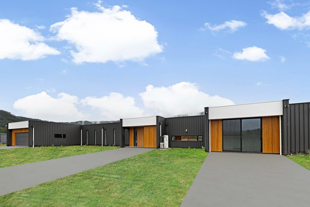 two storey house made of bricks and timber cladding