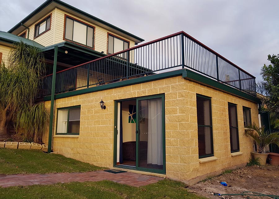 Yellow brick home with two storeys