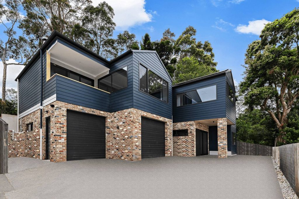 two storey house made of bricks and timber cladding