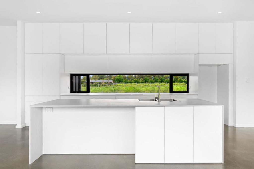 Monochromatic white kitchen counters and cabinets