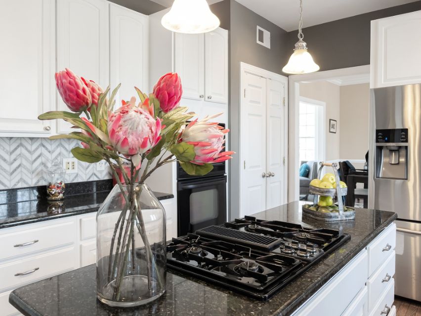 Modern kitchen with a beautiful bouquet on the kitchen island