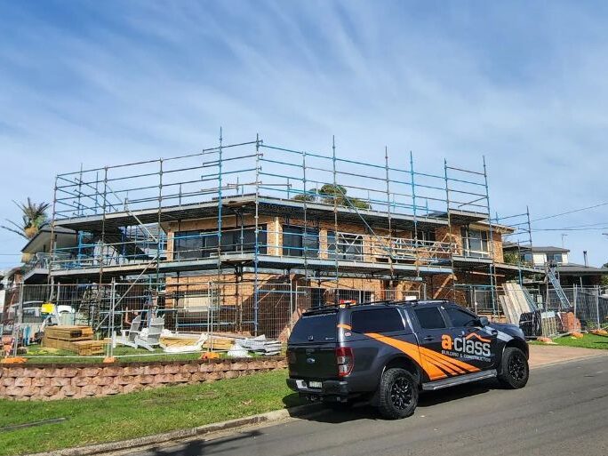 A class construction van outside home rebuild