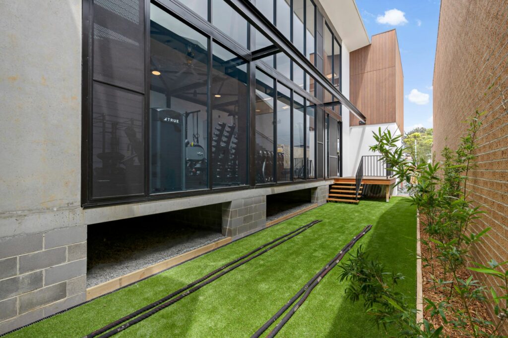 two storey house made of bricks and timber cladding