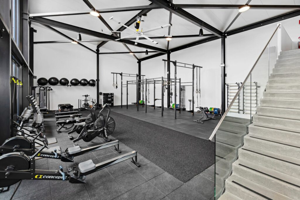 Inside a bright and clean gym with gym equipment