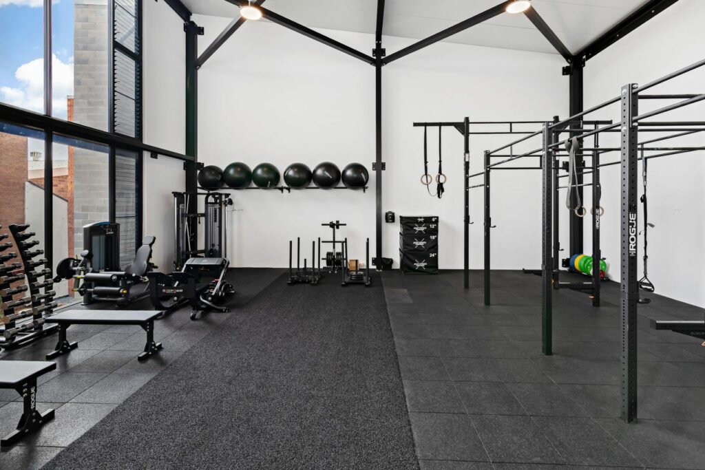 Inside a bright and clean gym with gym equipment