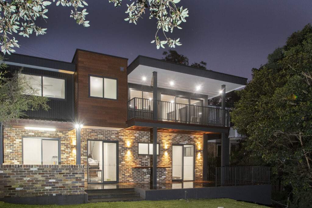 Two storey house with outdoor lighting