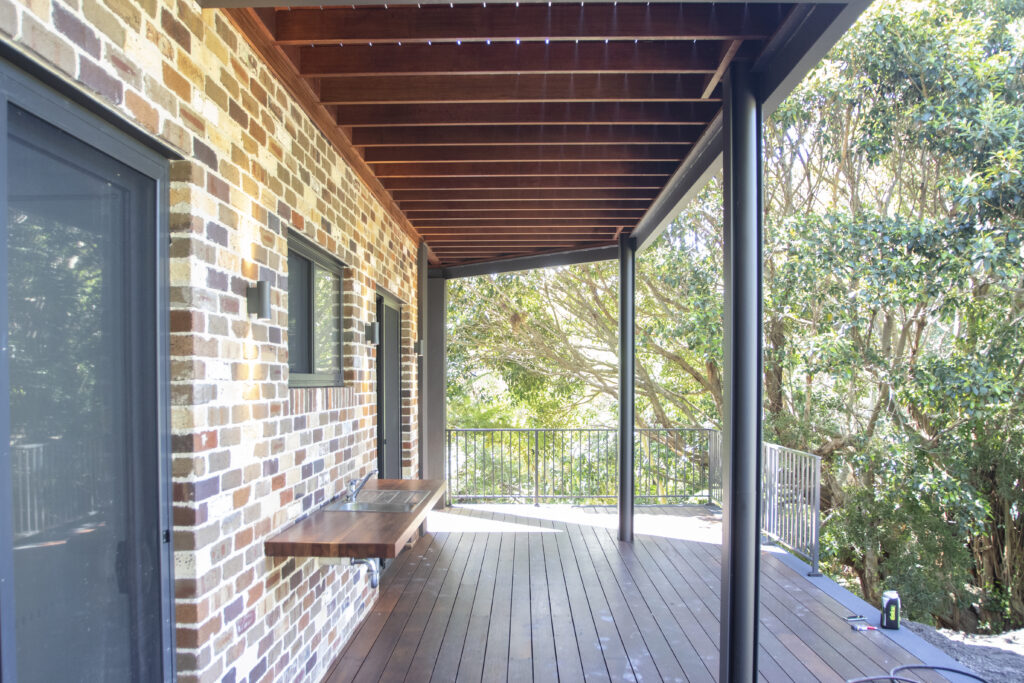 brick home with a porch