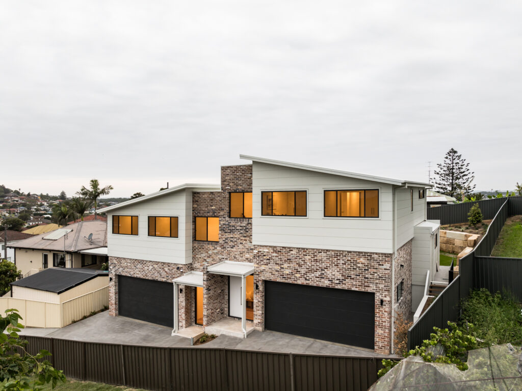 two storey house made of bricks and timber cladding